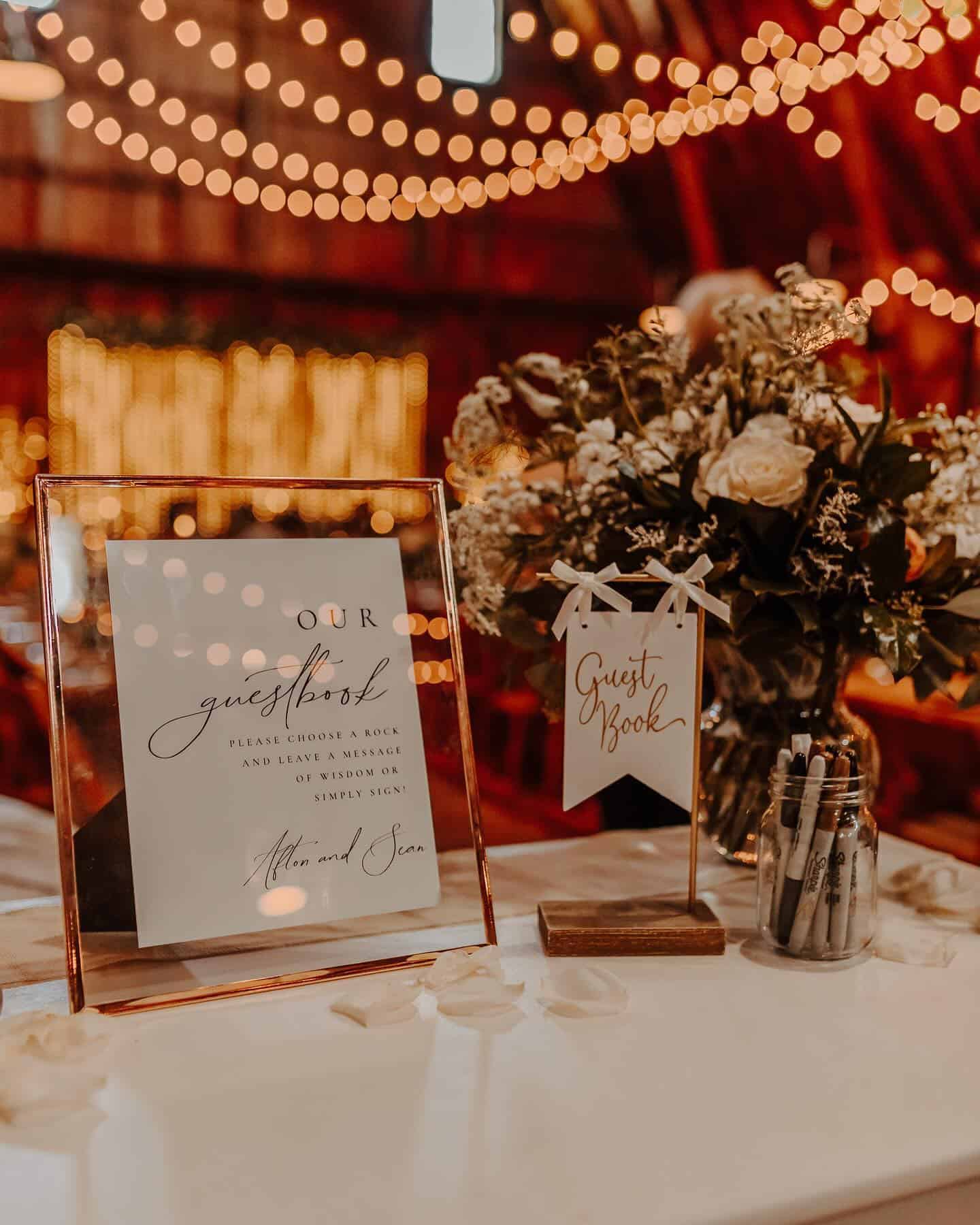 Wedding reception decor with flowers and string lights at Dellwood Barn.