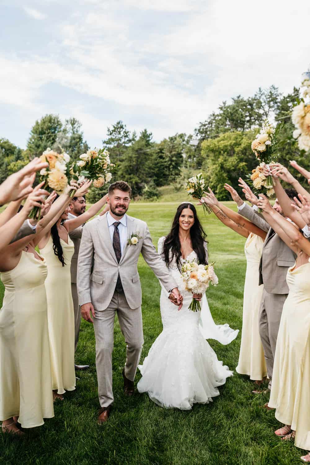 Wedding at Dellwood Barn with bride and groom surrounded by bridesmaids and groomsmen.