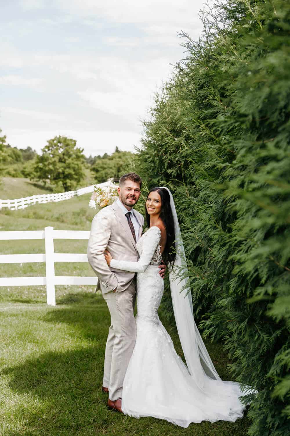 Wedding couple in wedding dress and suit at Dellwood Barn.