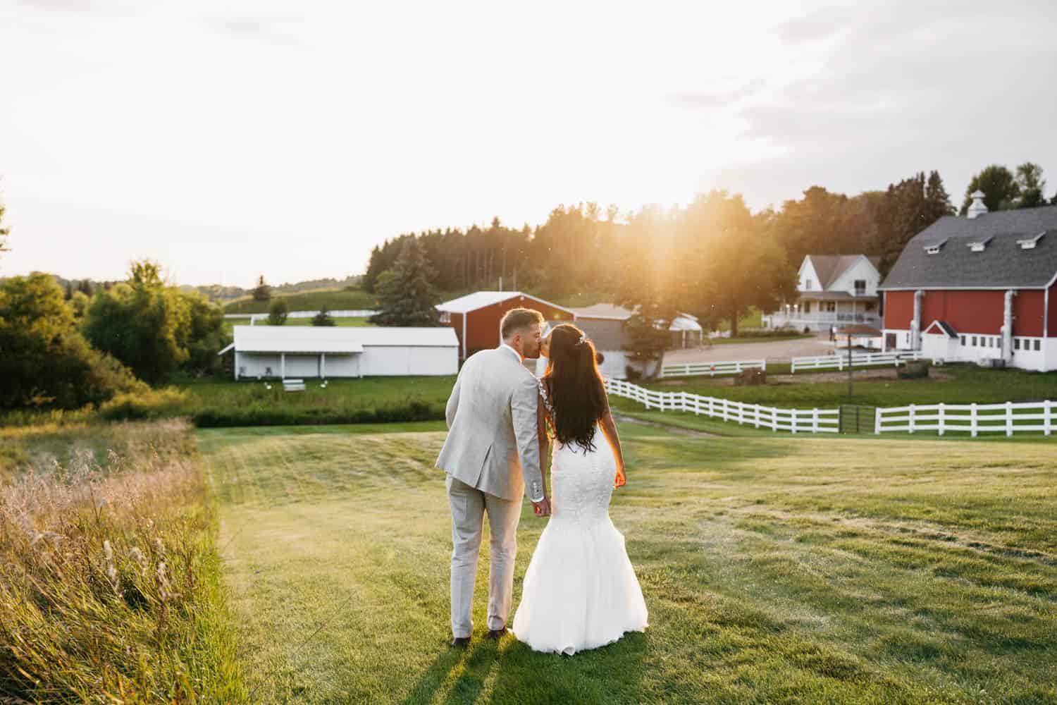 Elegant couple at Dellwood Barn wedding venue in scenic countryside.