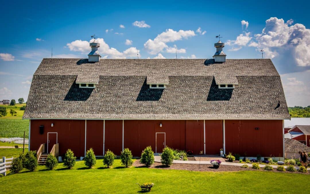 Barn wedding venue in a historic red barn with scenic countryside views.