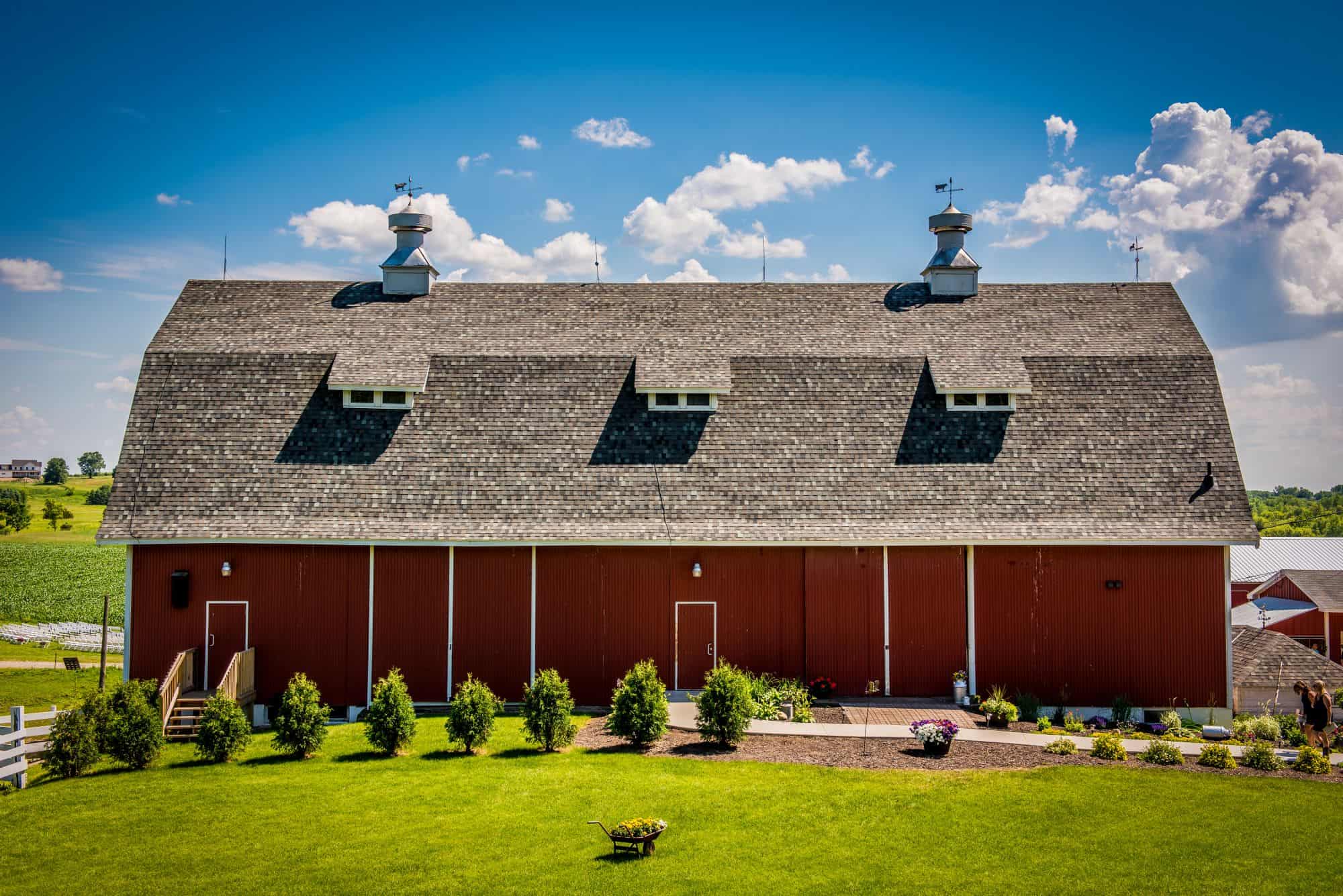 Barn wedding venue in a historic red barn with scenic countryside views.